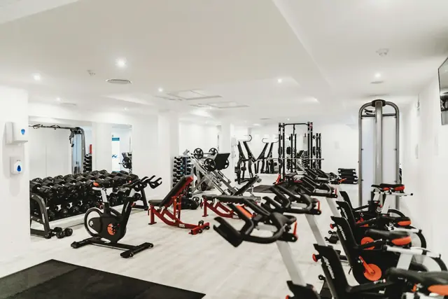 Bright modern gym with cardio machines