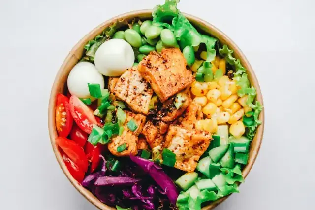 Bowl with salmon, eggs, edamame and vegetables
